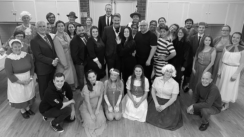 The Company of The Addams Family in rehearsal, with Nick Brannam (Director/Choreographer) and Trevor Defferd (Musical Director)